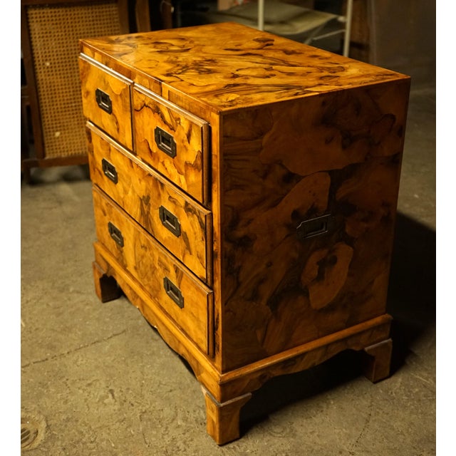 Petite burl olive campaign style chest. Chest has 4 drawers, 2 small drawers at the top and 2 larger drawers below. It has...