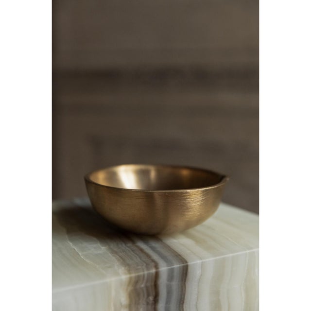 Golden bronze bowl by rick owens 2007 dimensions: l 14 x w 14 x h 8 cm materials: bronze weight: 1.5 kg the gold edition...