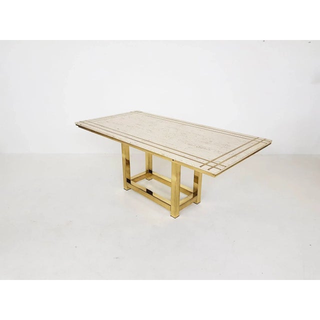 High-end travertine and gold plated metal dining table by Alain Delon. and impressive dining table made of the most...