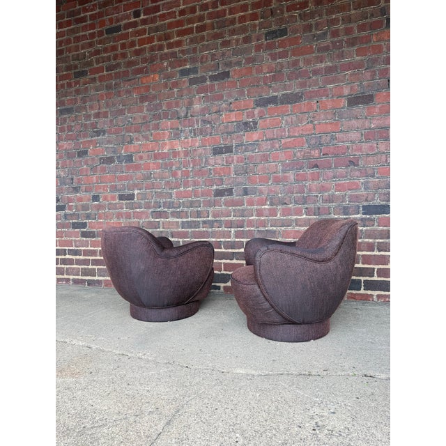 pair of swivel lounge chairs designed by legendary American furniture designer Vladimir Kagan and produced by Directional...