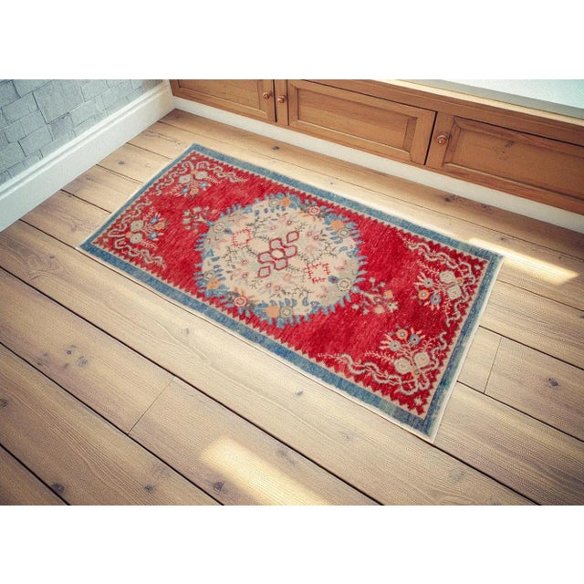 This is a beautiful vintage hand knotted distressed finish Rug from Turkey. It has bright primary colors on a fuzzy wuzzy...