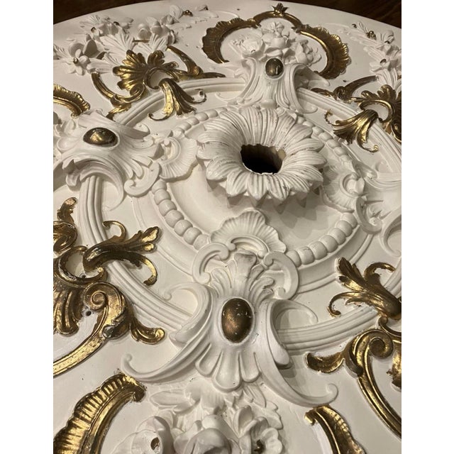 The 48" Round Gold Leaf Ceiling Medallion is a high-end Neoclassical decorative piece made of polyurethane material. This...