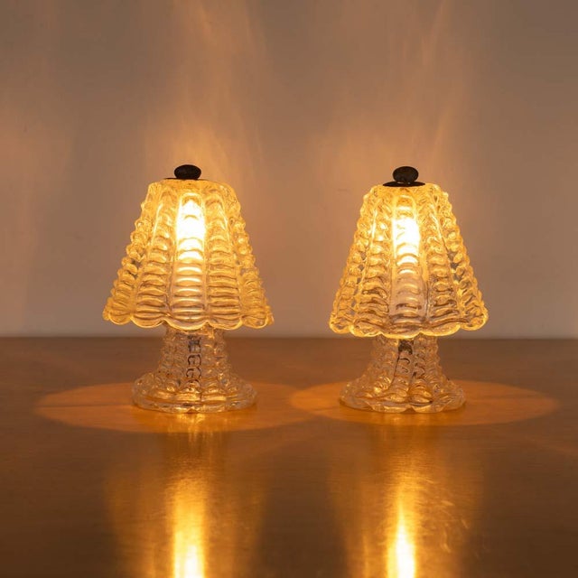 Stunning pair of petite Murano glass lamps from Italy, 1940s. Beautiful blown glass bell shade with scalloped trim and...