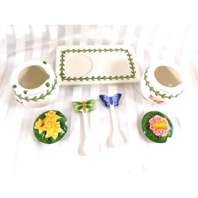 This is a seven piece honey pot set by Portmeirion in Botanic Garden. It includes and underplate or tray, two honey pots...