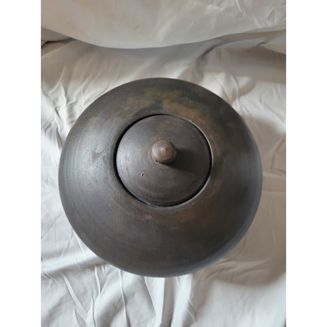 Large Raku Lidded Vessel. Unlgazed finish. In the style of Tony Evans. Dark fired finish has a Japandi look. There are...