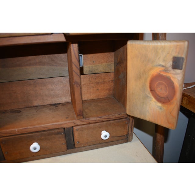 This vintage wooden wall cabinet is heavy & solid. Marked 1921 Furniture Co. Quality & handmade woodworks. Chunky drawers...