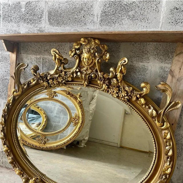 Impressive Oval mirror. So many beautiful carvings showing amazing craftsmanship. This is in stock ready to ship....