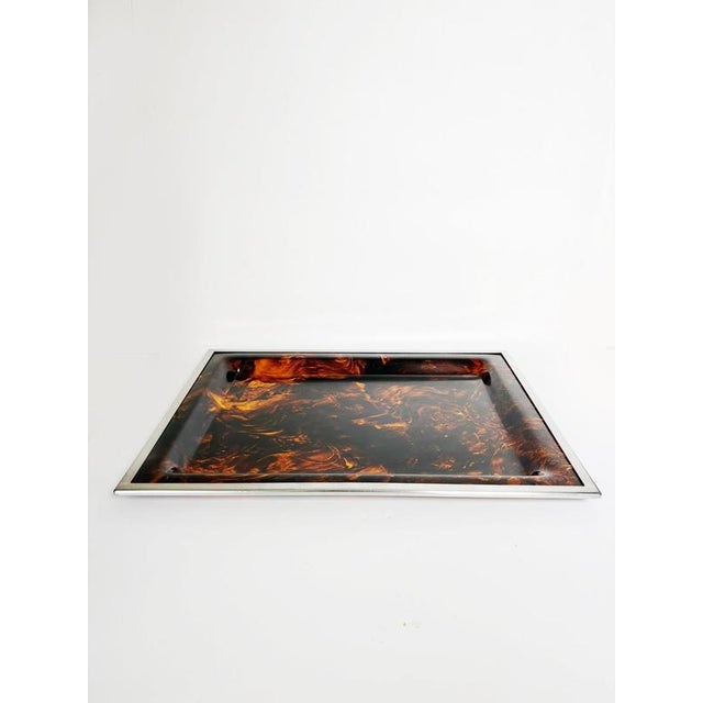 Rectangular metal tray with a tortoiseshell pattern, France, 1970s. This elegant rectangular metal tray features a...