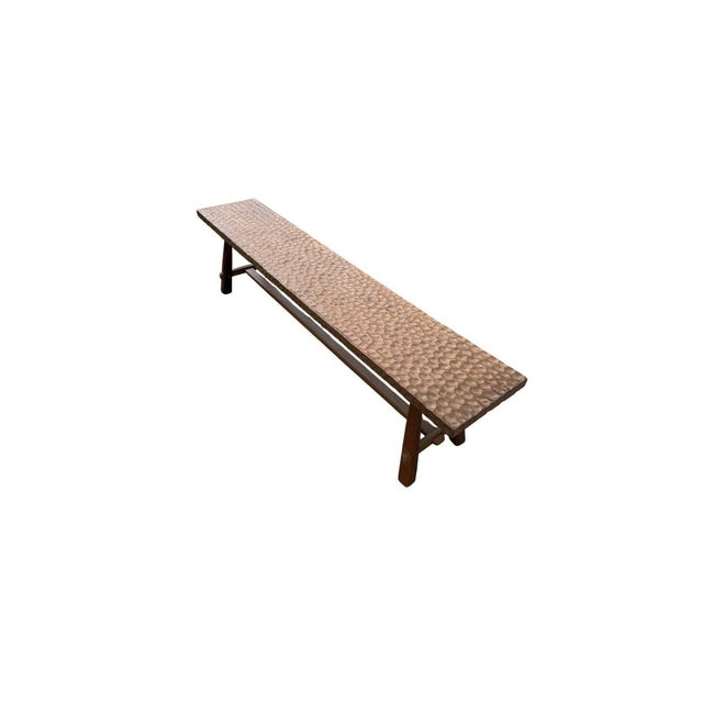 A striking expression of craftsmanship and natural material, this solid teak wood bench is distinguished by its...