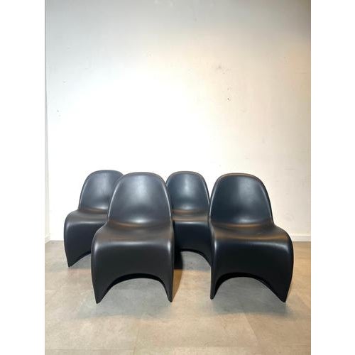 Iconic set of four original Panton chairs produced by Vitra and designed by Verner Panton. One of the most recognizable...