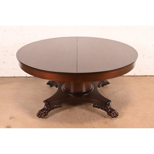 An outstanding antique Victorian or American Empire pedestal extension dining table In the manner of R.J. Horner & Co....