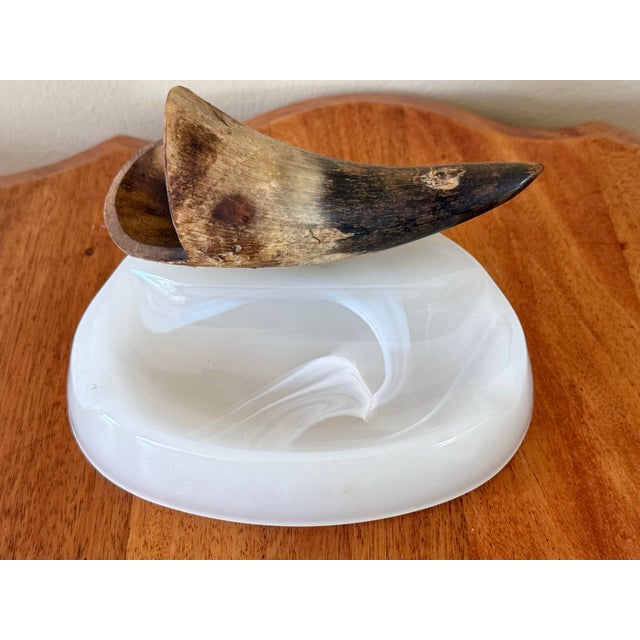 Vintage midcentury white glass ashtray with a natural horn embellishment for holding cigarettes. Please see condition...