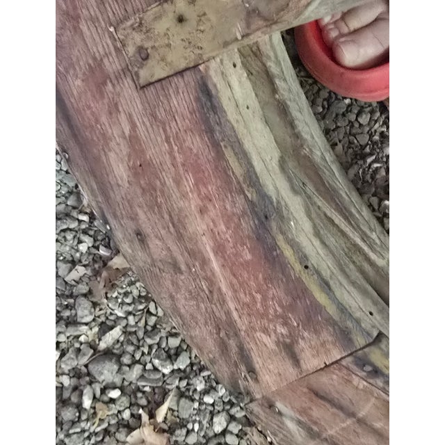 A sculptural industrial wheel with incredible presence and patina. This large wooden pulley wheel dates to the early...