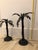 Two wrought iron palm tree statues with stunning rope and leaf detailing. These are two iron palm leaf candlesticks are...