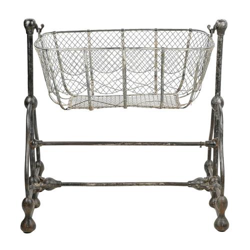 Antique metal cradle with tubular frame This piece is designed in the style of the selected designer and/or manufacturer