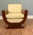 A striking Art Deco style armchair in richly figured walnut with bold, architectural lines The chair is defined by its...