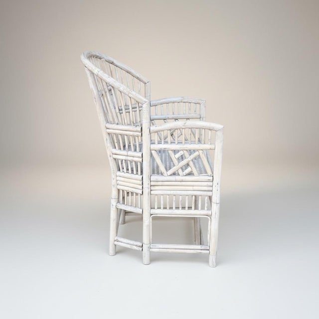 This is a pair of mid-century whitewashed Chinese Chippendale style bamboo chairs with new blue and white upholstery. The...