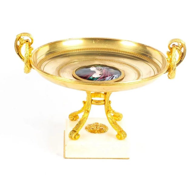 This is an impressive and highly decorative French ormolu tazza, mid-19th century in date. It features twin handles to...