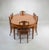 This English Edwardian Satinwood Dining Ensemble is inspired by the work of George Hepplewhite. The ensemble is made up of...