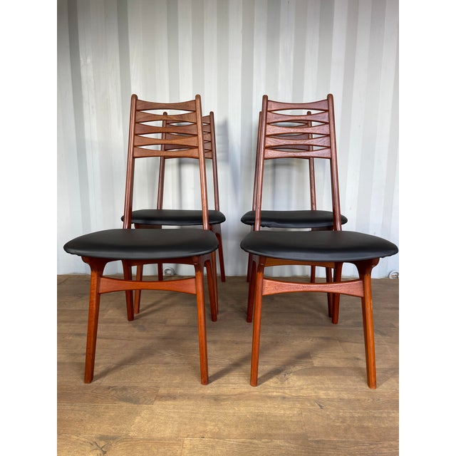 This refined set of four model 83 dining chairs by boltinge stolefabrik exemplifies the understated elegance of danish...