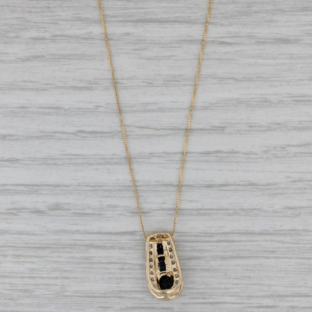 Gemstone Information: - Natural Sapphires - Total Carats - 0.68ctw Cut - Oval Brilliant, Square Color - Dark Blue...