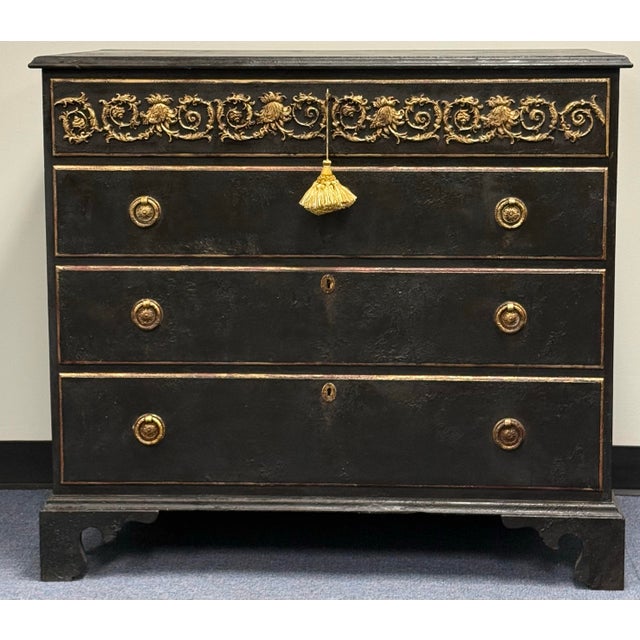 Newly hand-painted chest of drawers with a rich charcoal-black finish and beautifully aged gold accents. Ornate raised...