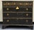 Newly hand-painted chest of drawers with a rich charcoal-black finish and beautifully aged gold accents. Ornate raised...
