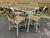 A vintage set of indoor or outdoor aluminum table and chairs. The square table measures 32" x 32" x 29.5"H and features a...