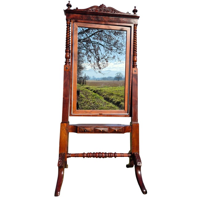 Elegant antique tilting floor mirror crafted in solid mahogany, dating to the late 19th / early 20th century. The piece...