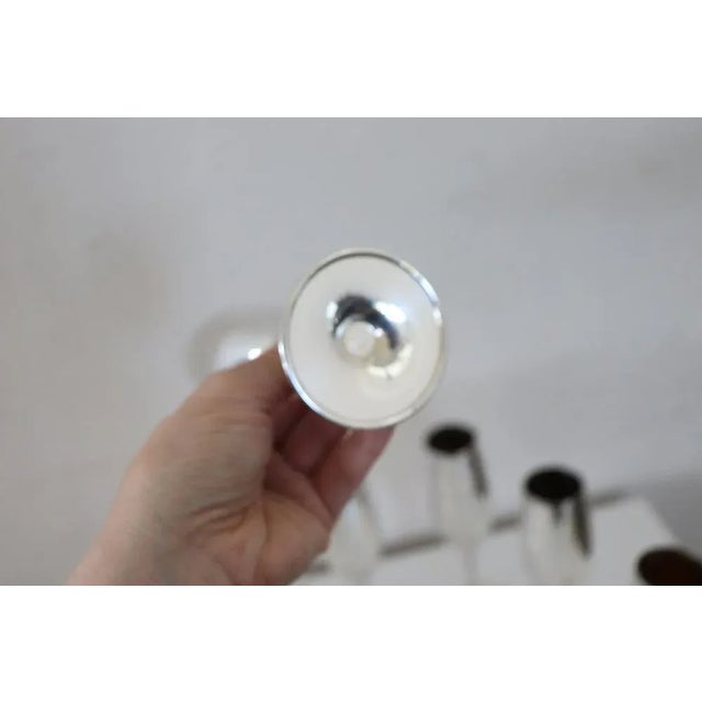 Beautiful set of six flute glasses in silver plated perfect for champagne. No brand present. Used but in good condition