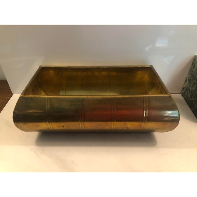 This stunning 1950s Contemporary Solid Brass Rectangle Planter is a sophisticated choice for the discerning homeowner....