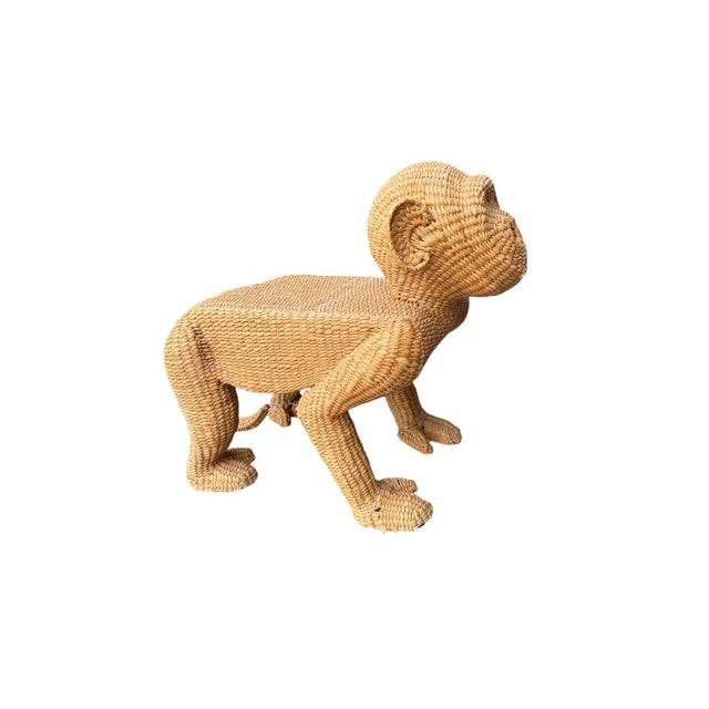 A vintage Mario Lopez Torres hand woven rattan bench in the shape of a monkey. The bench has the original tag on the...