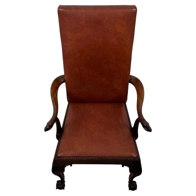 A handsome and imposing 19th-century English Victorian open armchair, finely crafted from mahogany and distinguished by...