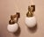 Pair of 'Astoria' wall lights in brass with opal glass globes. The original design was by Josef Hoffmann for the Grand...