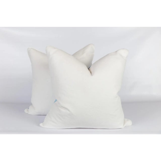 Pair of custom pillows made from Quadrille's China Seas Nitik II linen pattern fabric in turquoise colorway 149-33....