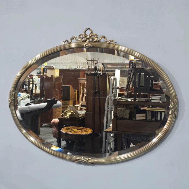 Excellent quality Victorian oval ribbed brass wall mirror with bow detailing to the top, bevelled plate glass, in very...