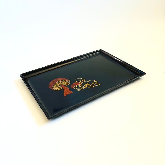 A large vintage rectangular resin tray made by Couroc of Monterey, California. Decorated with the image of mushrooms made...