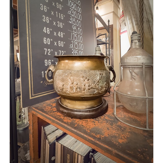 A Japanese Showa Period bronze pedestal planter with elephant handles and a wood base. Made in Japan between 1880 and...