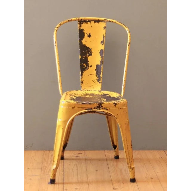 This tolix chair with original yellow paint was cleaned and the metal surface against rust was embedded. I have official...
