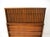 A walnut five drawer mid -century highboy dresser chest with unique curved front and streamline full length pulls having...