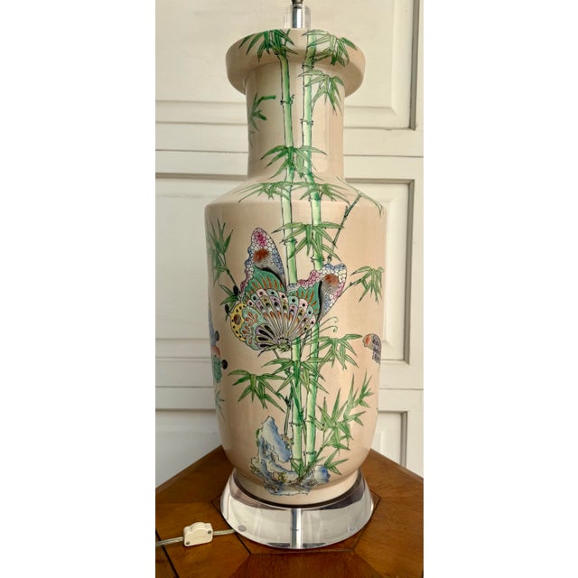 This vintage hand-painted Chinoiserie porcelain lamp beautifully balances timeless decorative artistry with a fresh,...