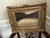 Atmospheric Tonalist landscape painting depicting a sweeping, muted countryside beneath a dramatic darkened sky. Rendered...