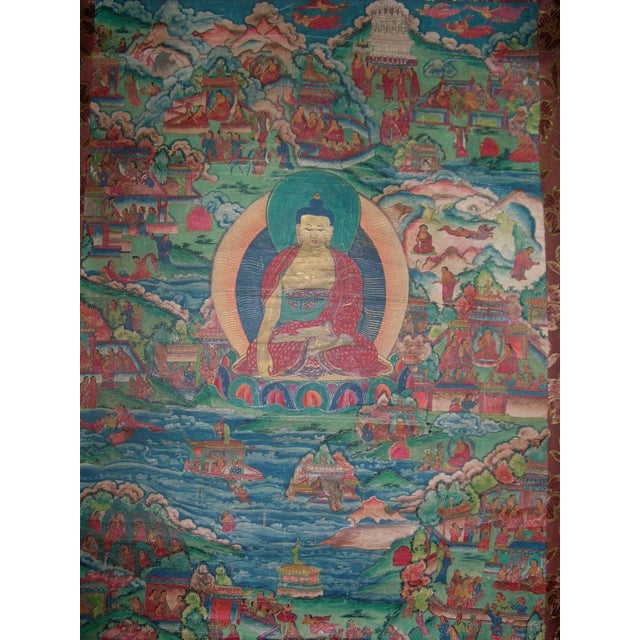 Unusual antique Buddhist Thangka* depicting Shakyamuni Buddha and his heavenly world, gouache on cotton canvas, mounted...