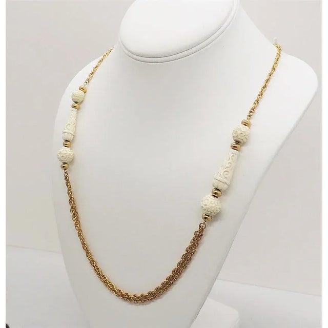 Plastic Vintage 1970s Signed Crown Trifari Carved Faux-Ivory Sautoir Necklace For Sale - Image 7 of 9