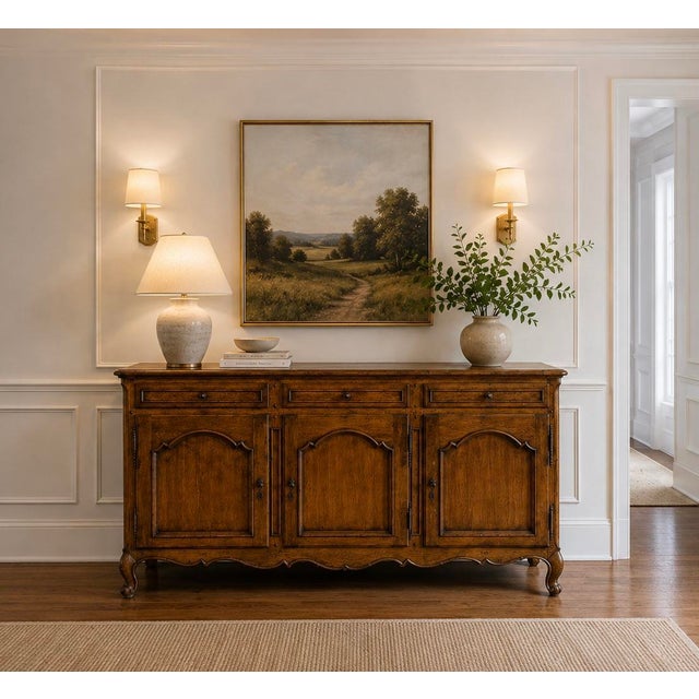 An exceptional French Country or French Provincial sideboard, media cabinet or credenza, in the style of Louis XV. There...
