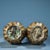 This matching pair is masterfully crafted from solid bronze with a rich, mottled green and brown patina. They feature...
