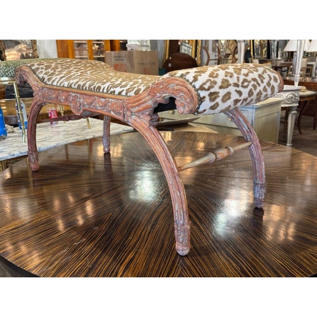 This 19th century Italian carved polychrome bench is a stunning piece of antique furniture, featuring intricate carvings...