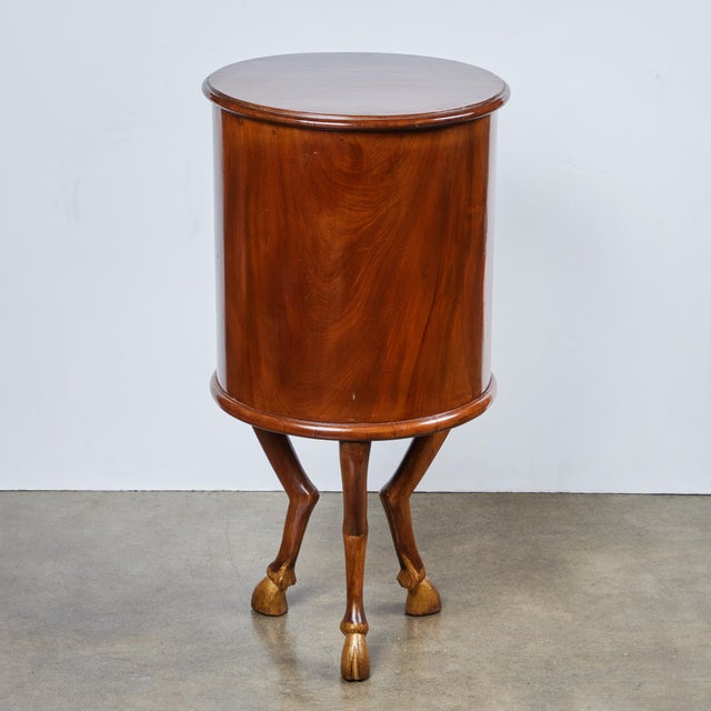 Unique pair of left and right, barrel form, single door, walnut tables, atop a tripod of bent legs terminating in gilt...
