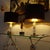 Pair of very large table lamps by Kaiser circa 1965-1970, featuring a structured glass column with polished and patinated...