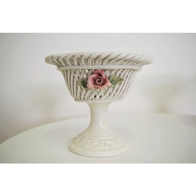 Centerpiece fruit bowl with ceramic flowers, 60s. the measures are: d19 x h16 d31 x h20 this piece has an attribution...